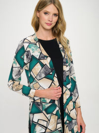 Model wearing a Long Sleeve Cardigan with a bold geometric print in teal and beige, showcasing its stylish open-front design.