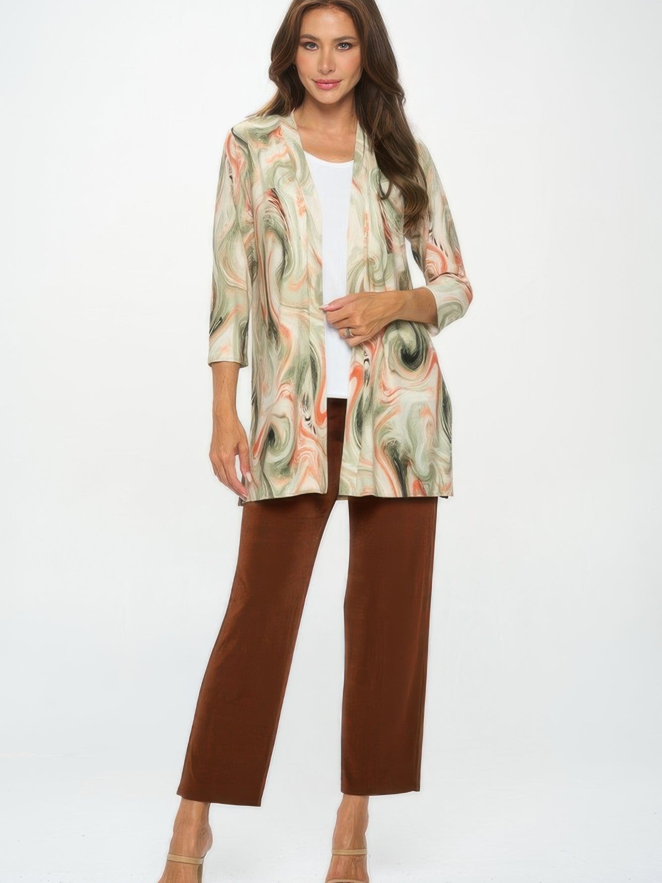 Long Sleeve Cardigan worn over a white top and brown pants, featuring a bold printed design in soft colors.