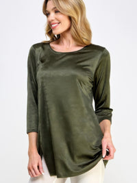 Washed Satin Elegance Top featuring a model wearing a green satin top with three-quarter sleeves and a round neckline.