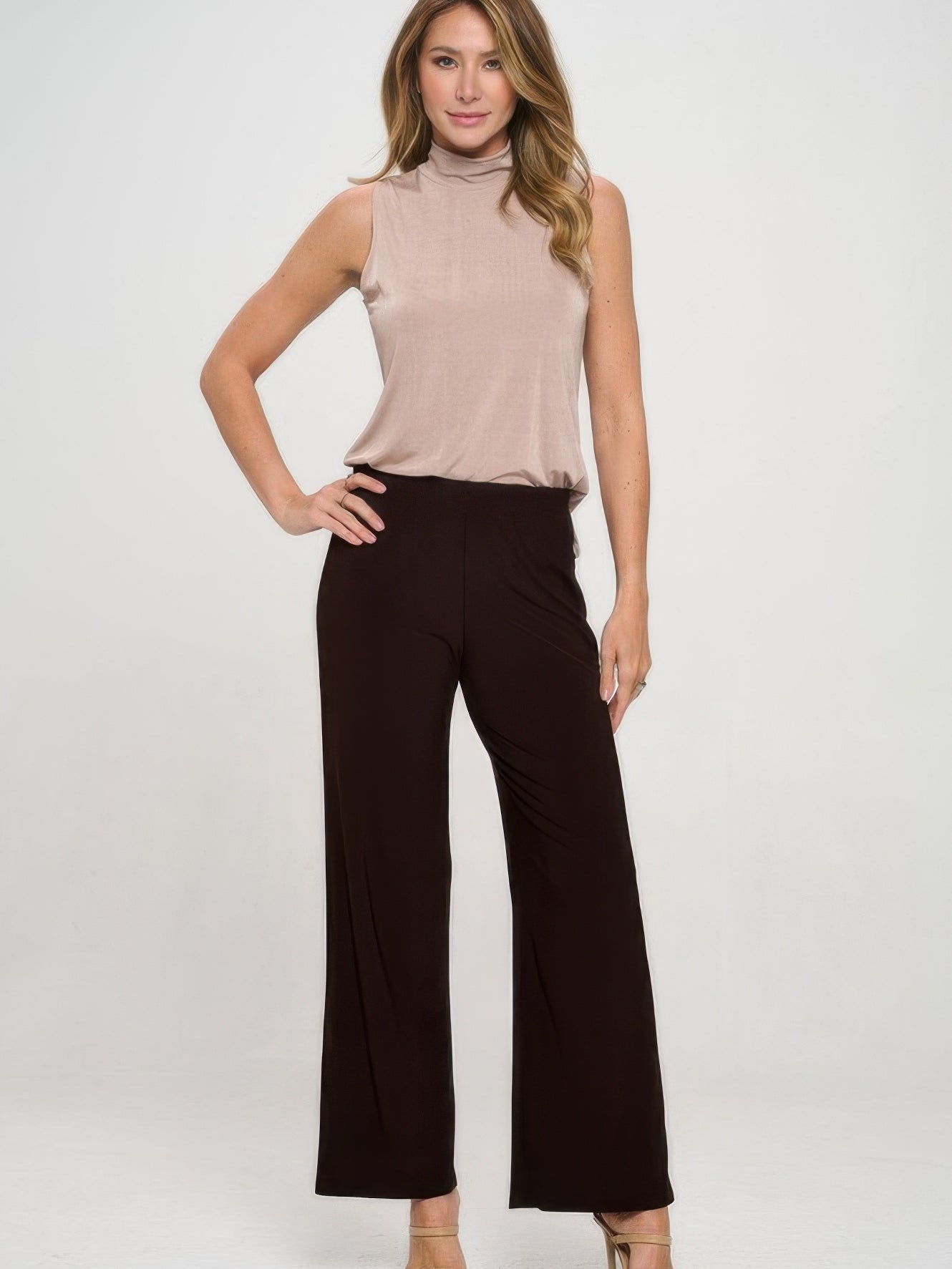 Model wearing Elastic Waistband Flared Pants paired with a sleeveless top, showcasing a stylish outfit.