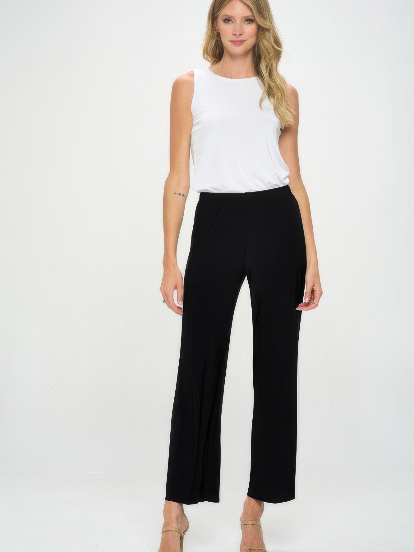 Model wearing Elastic Waistband Flared Pants with a white top against a neutral background.