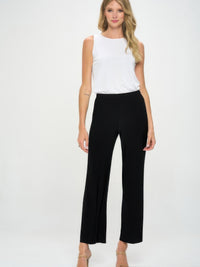 Model wearing Elastic Waistband Flared Pants with a white top against a neutral background.