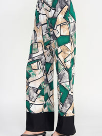 HIT Flared Pants in a colorful geometric print, offering a stylish fit and fluid movement, perfect for versatile dressing.