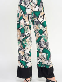 HIT Flared Pants featuring a geometric print in green and black with a comfortable fit and stylish flair.
