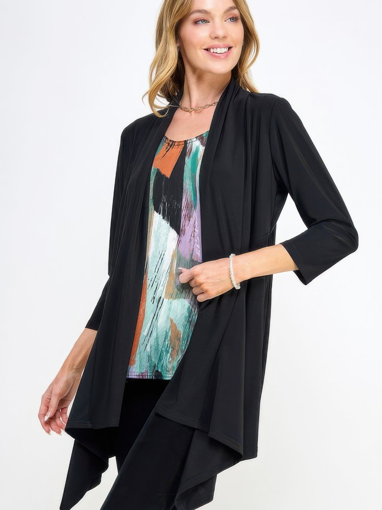 Model wearing a Draped Quarter Jacket over a colorful top, showcasing its elegant and easygoing style.