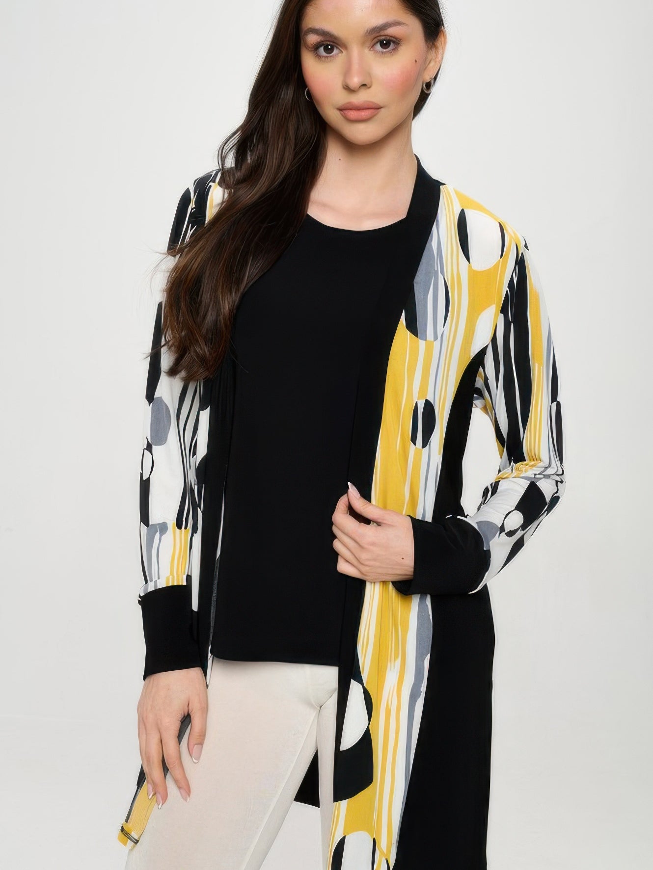 Contrast Jacket worn by a model, showcasing a bold black and print design with long sleeves and an open front.