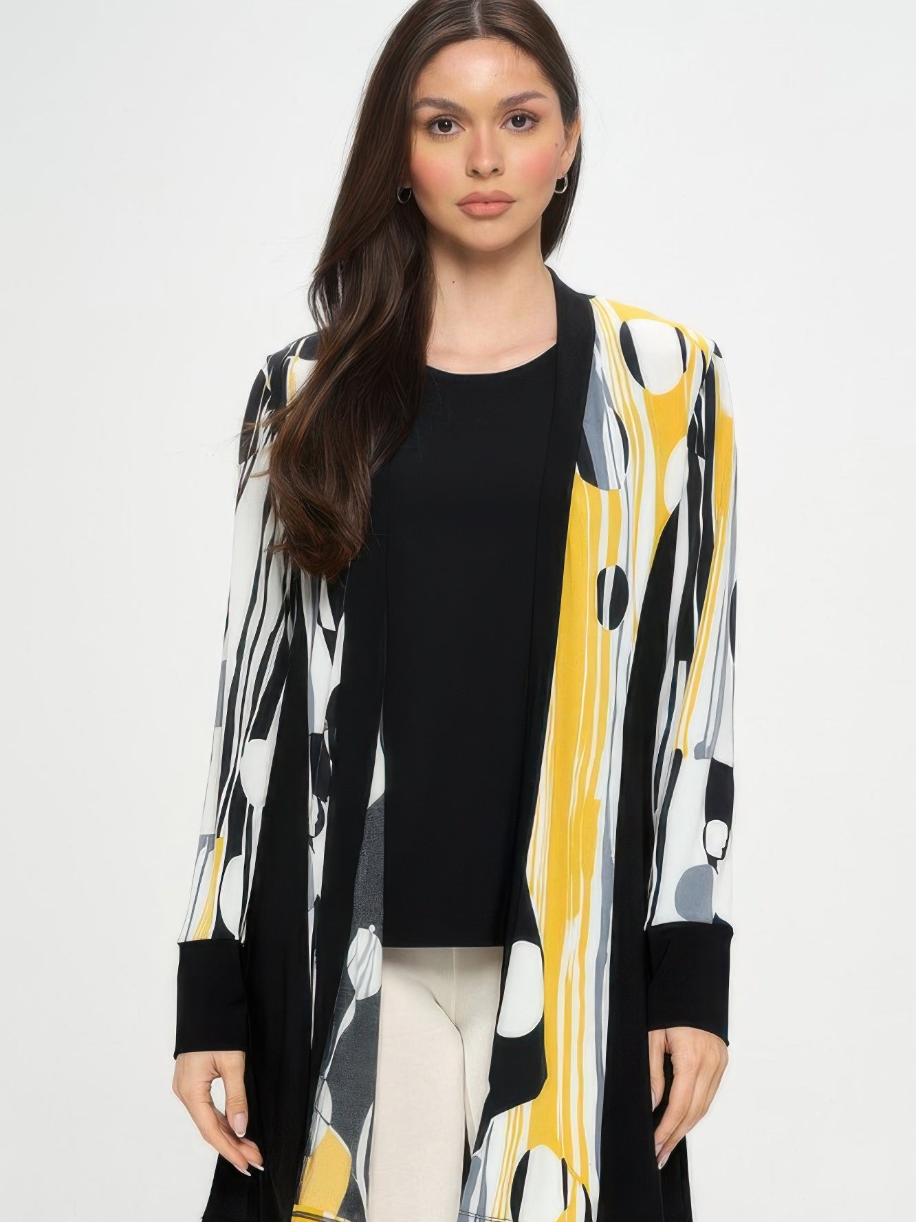 Stylish woman wearing a Contrast Jacket with bold black-and-print design and long sleeves.