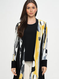 Stylish woman wearing a Contrast Jacket with bold black-and-print design and long sleeves.