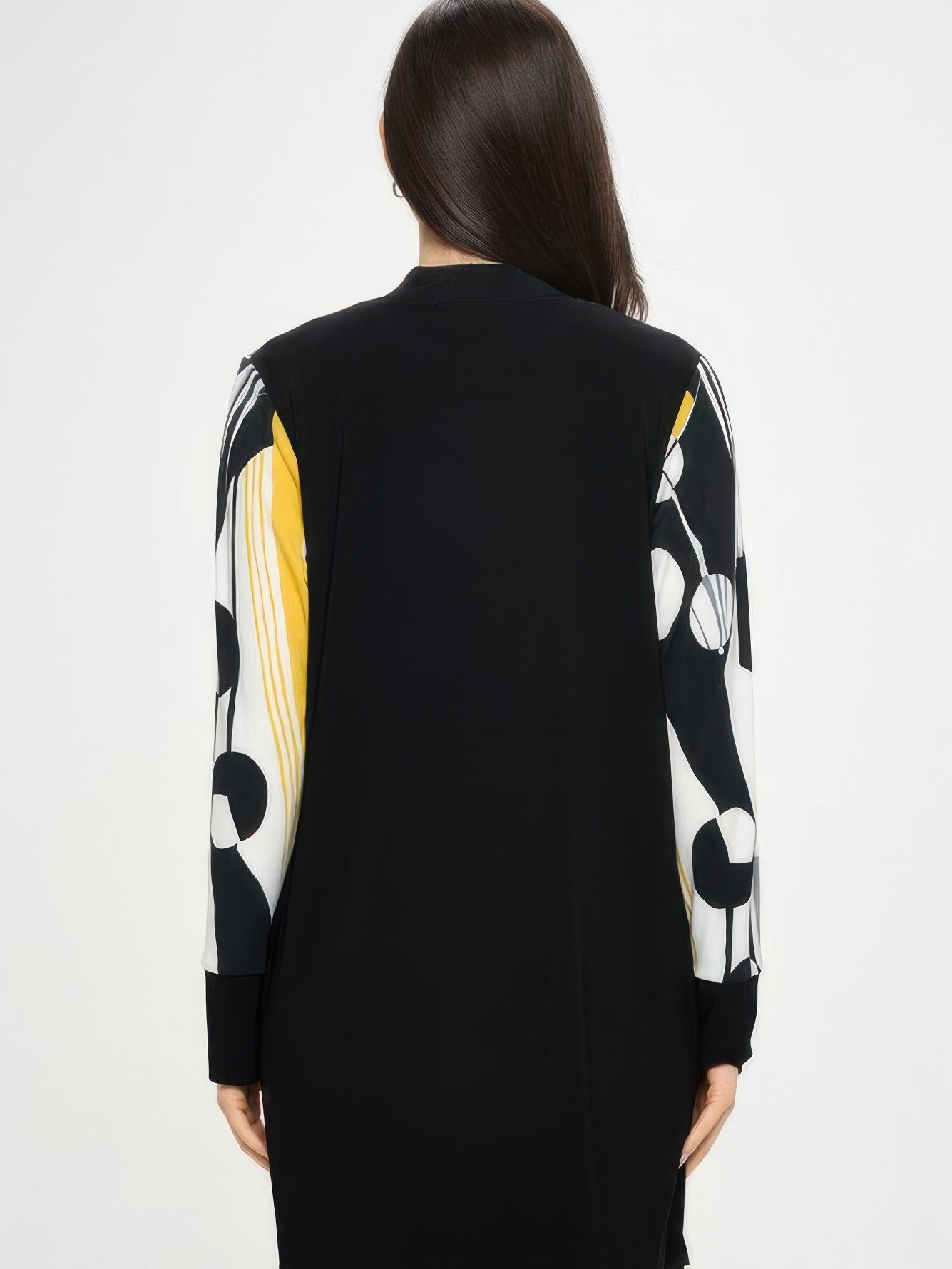 Back view of Contrast Jacket featuring bold black and print design and long sleeves.