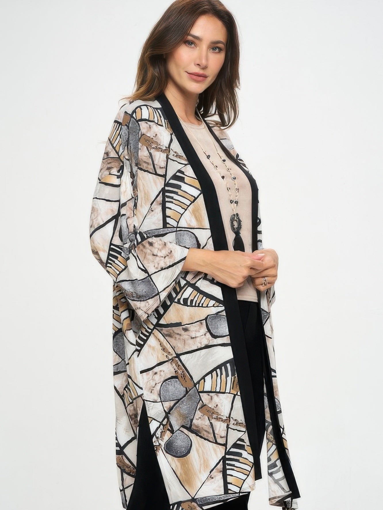 Long Contrast Jacket worn by a model, showcasing a stylish design with quarter-length sleeves and unique patterns.