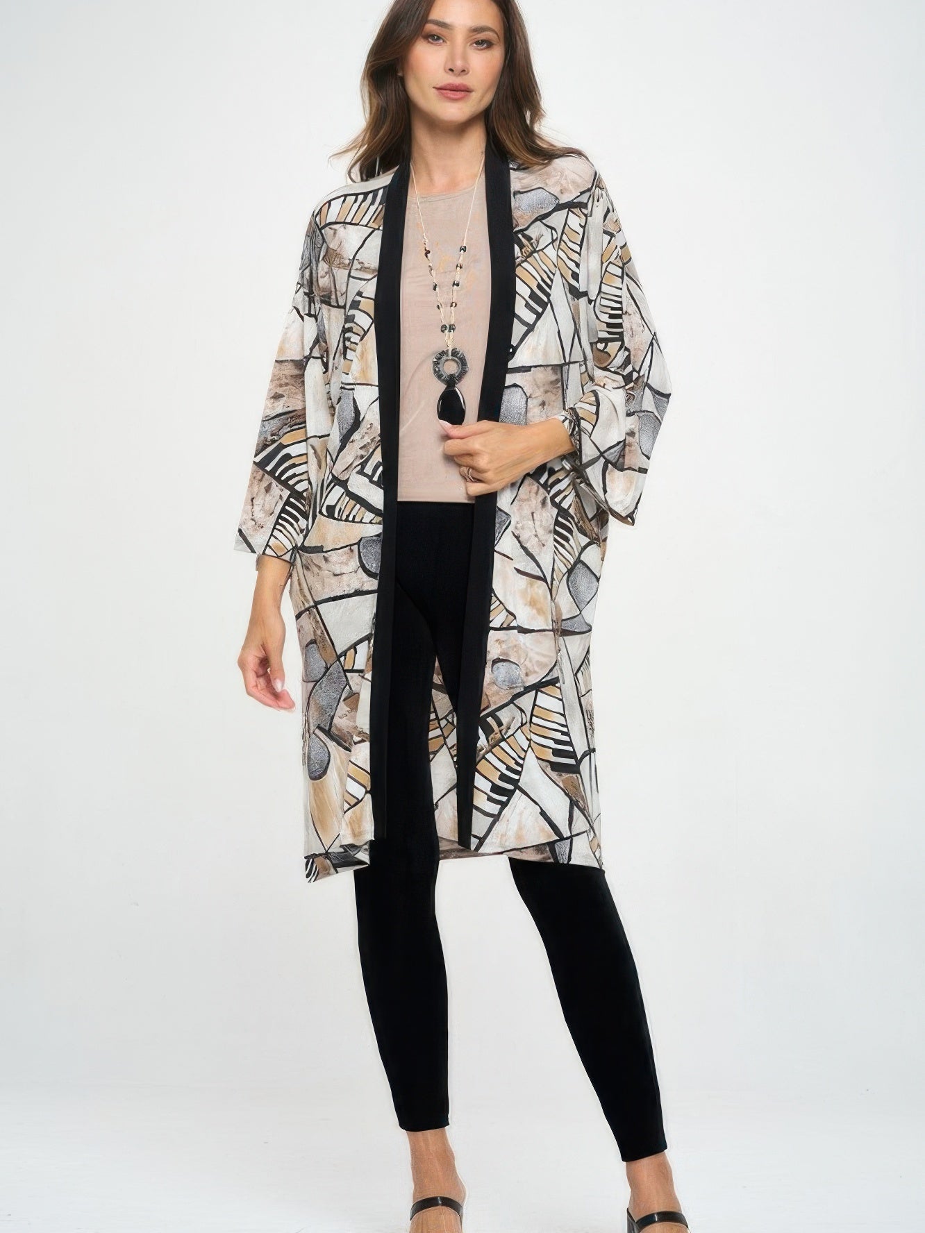 Long Contrast Jacket worn by a model, featuring quarter-length sleeves and a stylish geometric pattern.