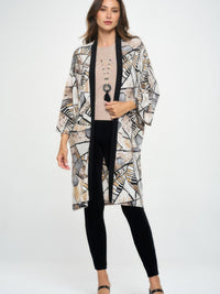 Long Contrast Jacket worn by a model, featuring quarter-length sleeves and a stylish geometric pattern.