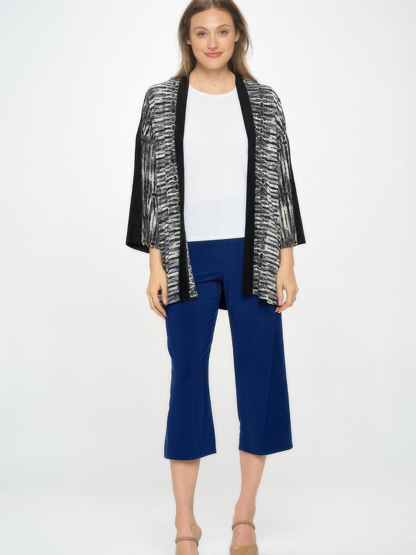 Model wearing HIT Kimono Jacket over a white top and blue pants, showcasing its relaxed silhouette and stylish design.