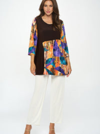 Contrast Curve Knit Top modeled with colorful accents and elegant design, showcasing its versatile style.