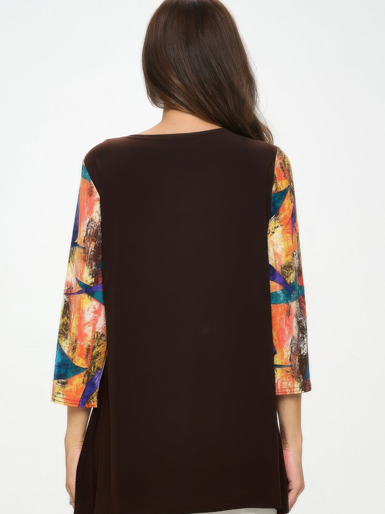 Back view of the Contrast Curve Knit Top showcasing colorful sleeves and a solid dark body.