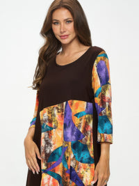 Contrast Curve Knit Top featuring colorful curved color-blocking design and quarter sleeves.