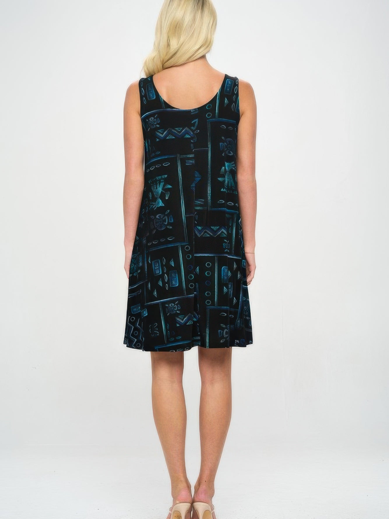 Back view of the BNS Missy Tank Dress, showcasing its black fabric with teal and aqua design.