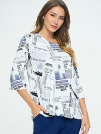 Plus Size BNS Print Missy Top displayed on a model, featuring a soft round neckline and three-quarter sleeves.