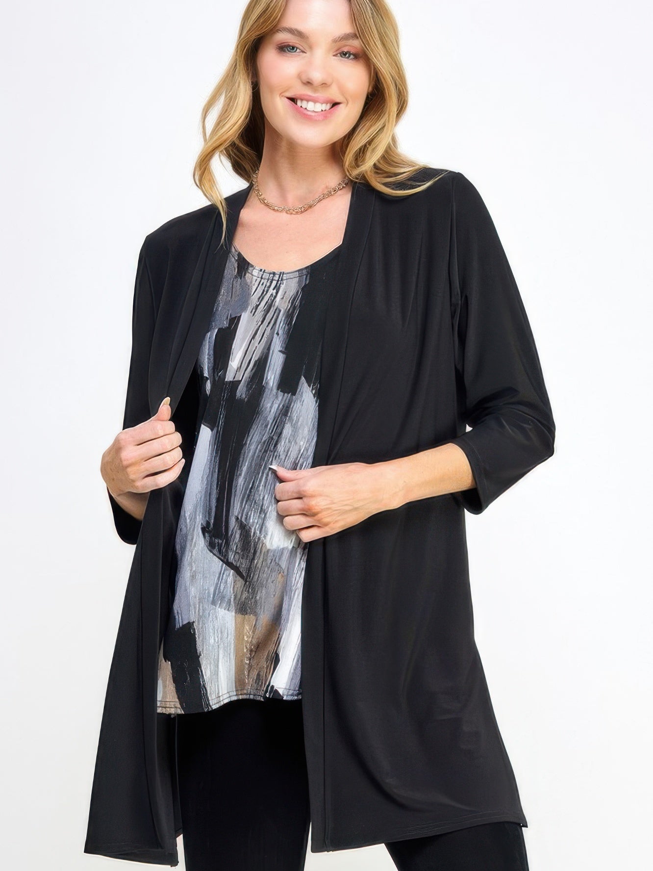 Model wearing the Hit Duster Jacket over a patterned top, showcasing its relaxed and polished style.