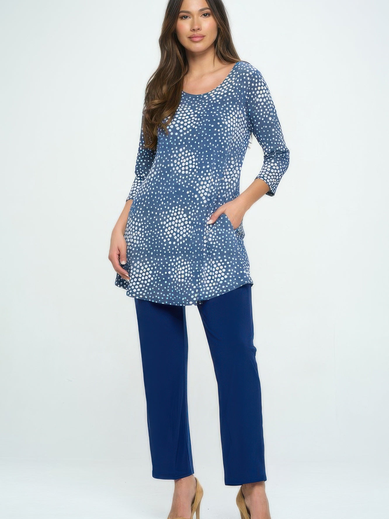 Hit Round Neck Tunic With Pocket styled with navy pants, featuring a polka dot pattern and side pockets.