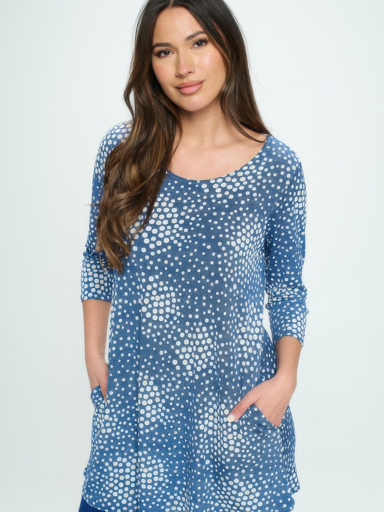 Hit Round Neck Tunic With Pocket modeled by a woman, featuring a blue dotted design and side pockets.