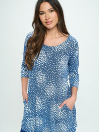 Hit Round Neck Tunic With Pocket modeled by a woman, featuring a blue dotted design and side pockets.