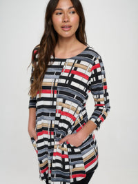 Hit Round Neck Tunic With Pocket featuring a stylish print and convenient side pockets for everyday wear.