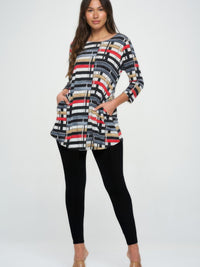 Hit Round Neck Tunic With Pocket, featuring a colorful striped design and side seam pockets, paired with leggings.