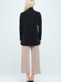 Model wearing BNS Mock Turtle Neck Top paired with light beige wide-leg pants from the back.