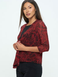 Open Cardigan in red with leaf pattern, perfect for layering and versatile styling options.