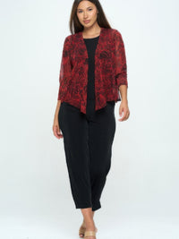 Open Cardigan in red floral pattern, worn over a black outfit, showcasing trendy layering options for versatile styling.