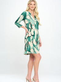 Hit Notch Neck Quarter Sleeve Dress in a vibrant green print with quarter-length sleeves, styled for a chic look.