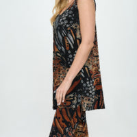 Round Neck Tank Top And Capri Pants Set modeled by a smiling woman, featuring a vibrant print and relaxed fit.