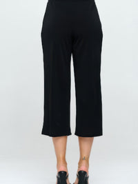 Back view of Moss Crepe Wide Leg Angle Pants in black, showcasing a stylish, tailored fit and ankle-length cut.