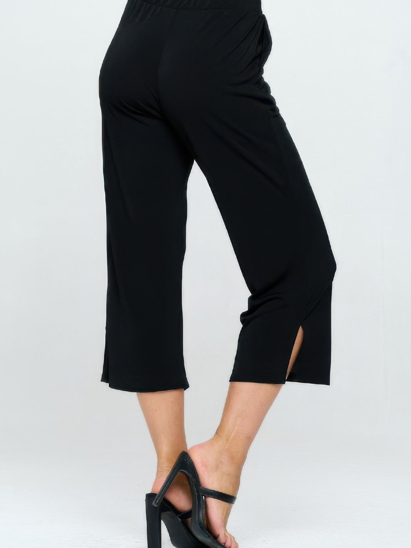 Moss Crepe Wide Leg Angle Pants showcased in black, featuring a flattering silhouette and ankle-length cut.