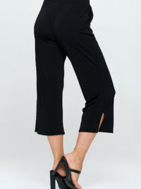 Moss Crepe Wide Leg Angle Pants showcased in black, featuring a flattering silhouette and ankle-length cut.