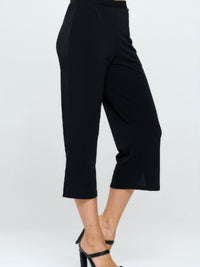 Moss Crepe Wide Leg Angle Pants in black, featuring a stylish cropped design and tailored silhouette.