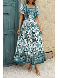 Square Neck Floral Printed Ankle Length A Line Dress on model in front of door with floral patterns and soft colors.