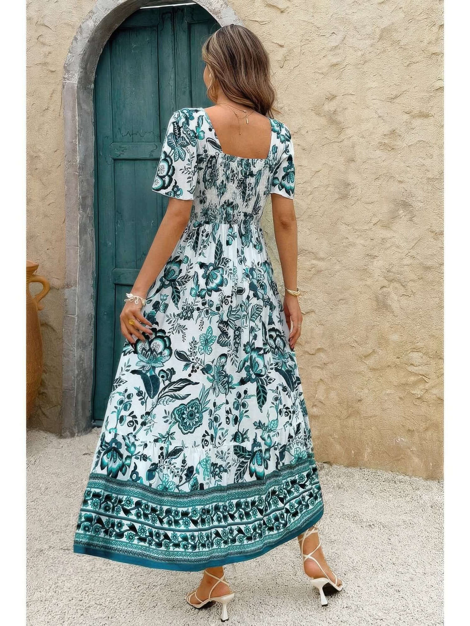 Woman wearing a Square Neck Floral Printed Ankle Length A Line Dress, featuring a bohemian floral design in teal and white.