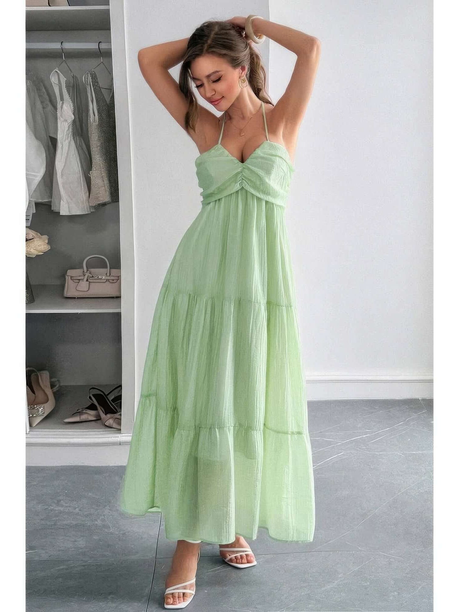 Solid Halter Muse Tiered Ruffle Long Dress in light green, showcasing a flowy, elegant design with ruffled layers and halter neckline.