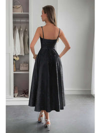 Back view of a model wearing a Solid Floral Jacquard Lace High Waist Dress in a stylish setting.