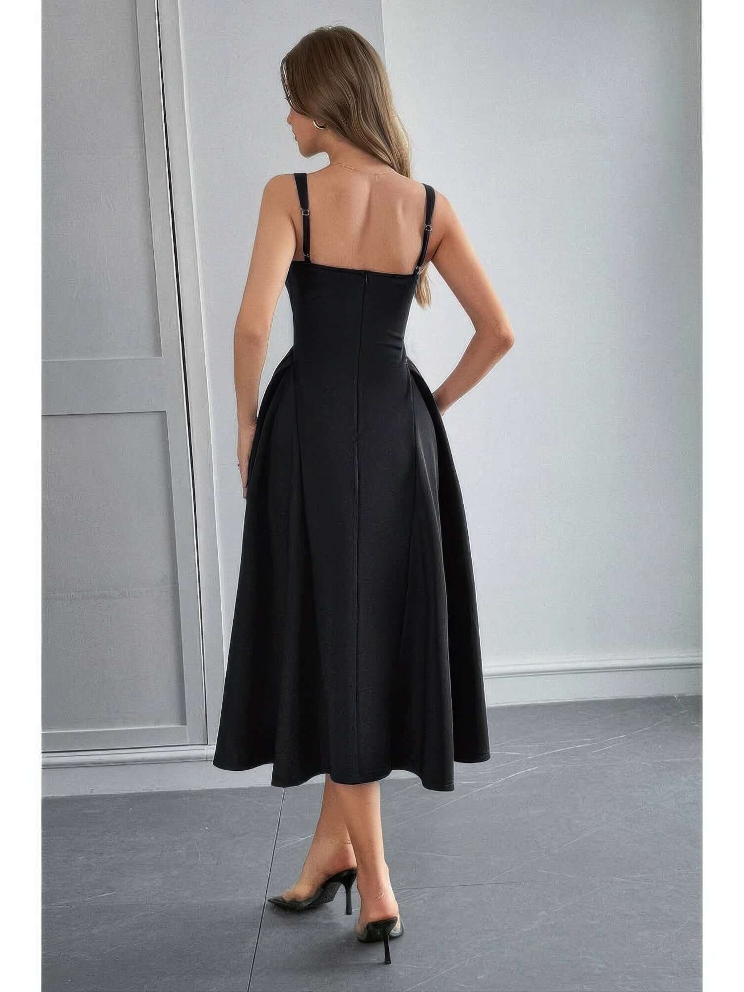 Back view of a model wearing a Square Neck A Line Pleated Sleeveless Long Dress in elegant black.