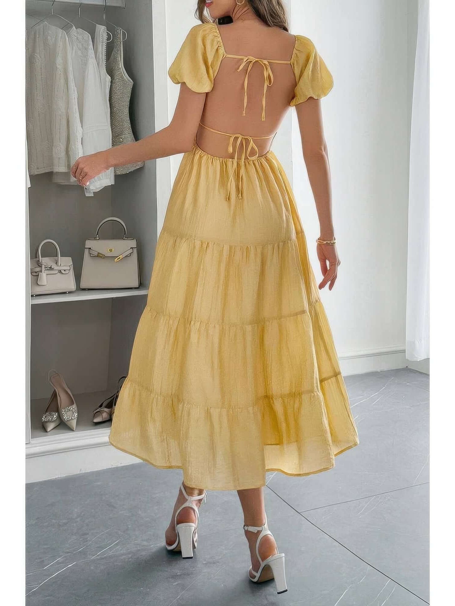 Solid Backless Tiered Puff Sleeve Fit Midi Dress in yellow, showcasing back view with puff sleeves and tiered skirt.