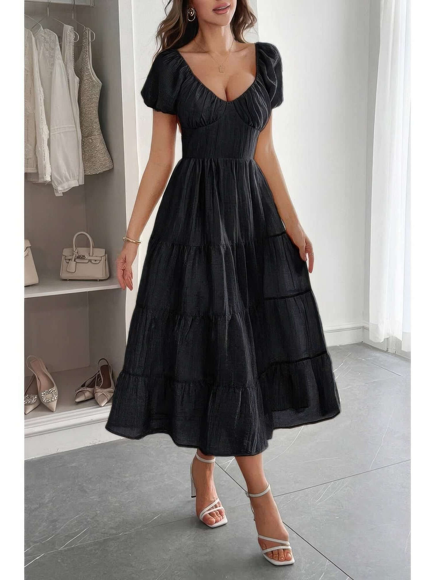 Solid Backless Tiered Puff Sleeve Fit Midi Dress worn by a model, showcasing its romantic design and flowing tiered skirt.