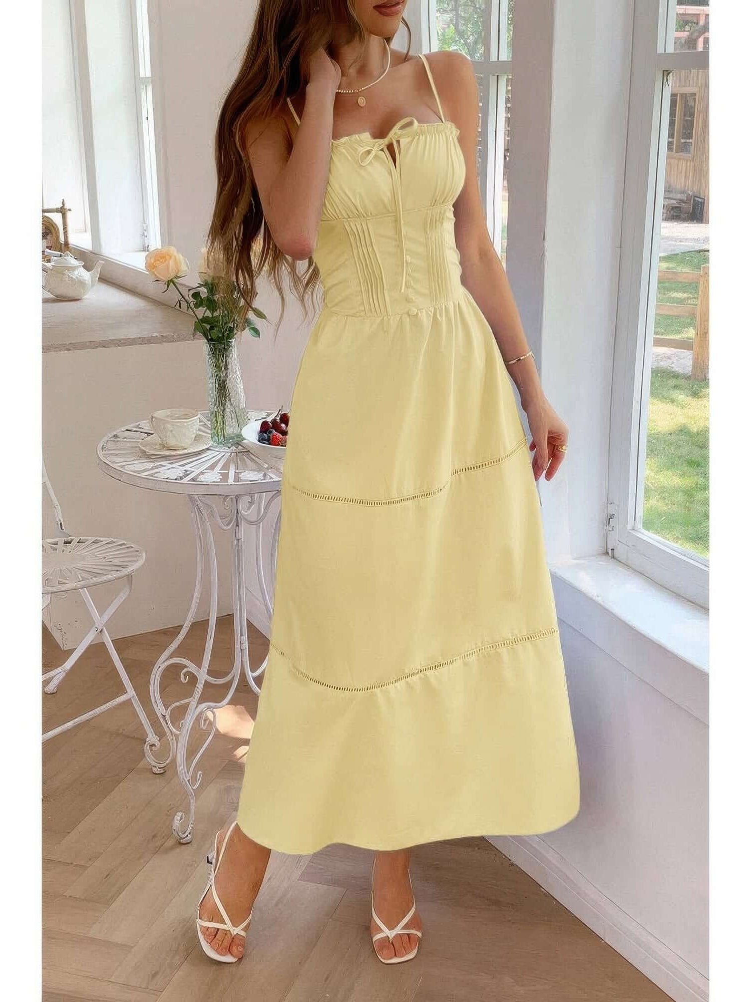 Solid Button Decor Pintuck Eyelet Shirred Dress in yellow with delicate button detail and a flattering shirred waistline.
