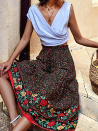 Drawstring Floral Ruffled Maxi Skirt worn with a white top, featuring a floral pattern and ruffle details.