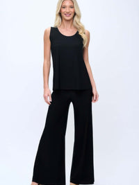 Woman wearing Hit Palazzo Pants with a sleeveless top, showcasing comfort and stylish wide-leg design.
