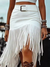 Asymmetrical Fringe Skirt with white fringe detailing, featuring a stylish belt and a trendy high-low hem.