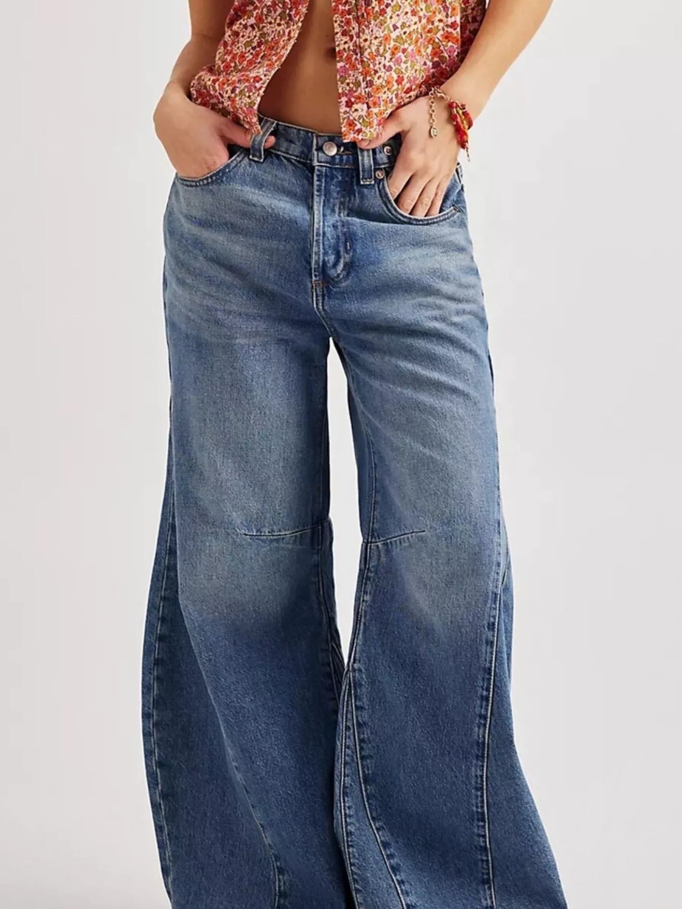 Model wearing Washed Wide Leg Jeans with a floral top, showcasing a stylish and relaxed fit.