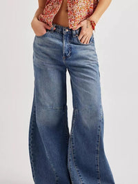 Model wearing Washed Wide Leg Jeans with a floral top, showcasing a stylish and relaxed fit.